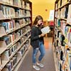 Girl standing in library