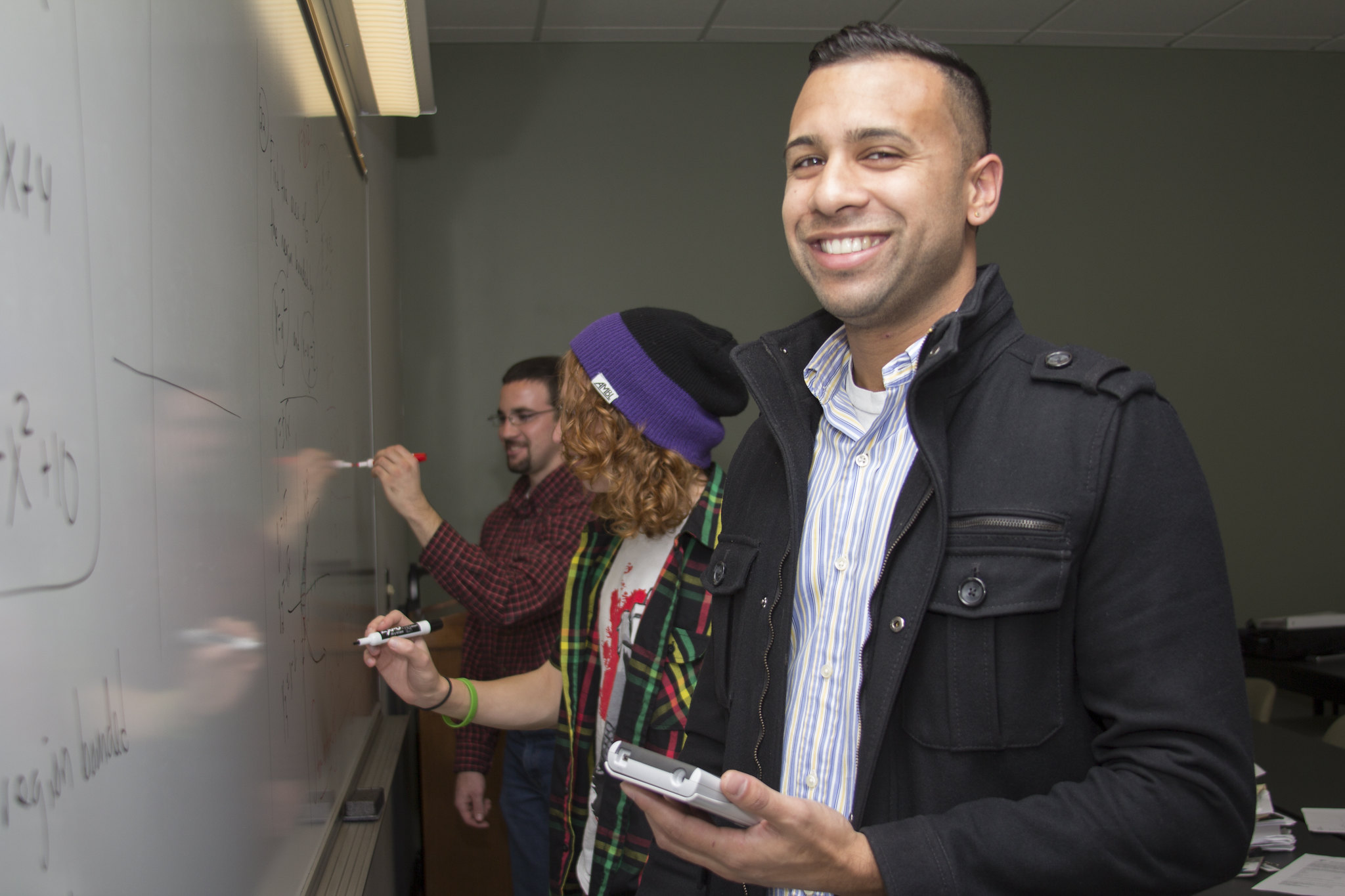 Man at dry erase board Man at dry erase board