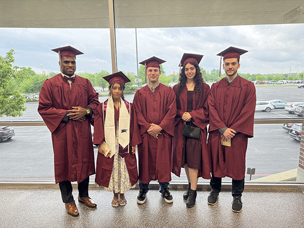 A group of graduating students wearing Commencement regalia